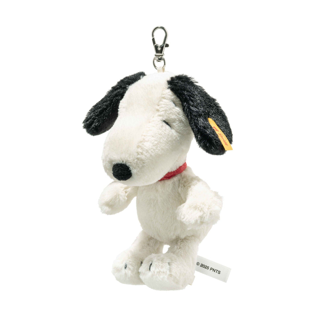 Plush Snoopy keychain with a Steiff tag on a white background