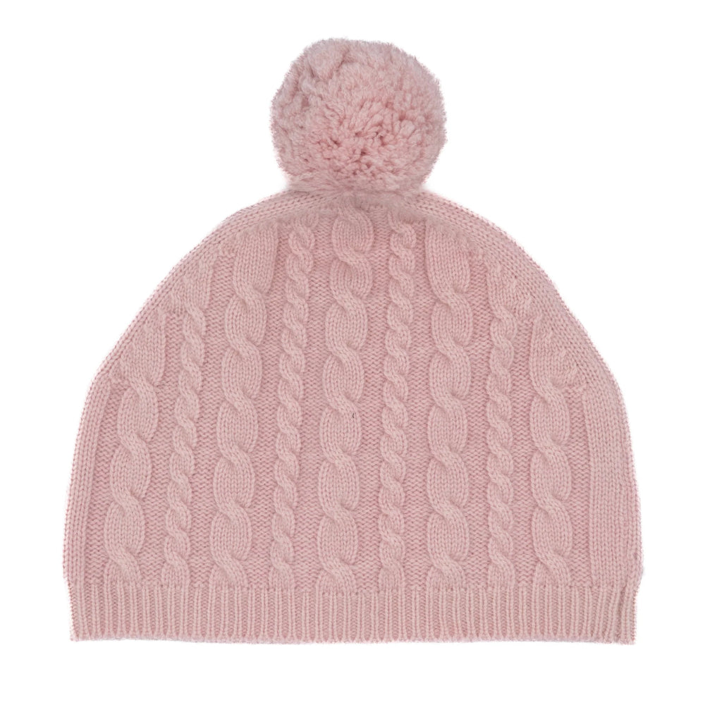 Pink knitted beanie with a pom-pom on a white background