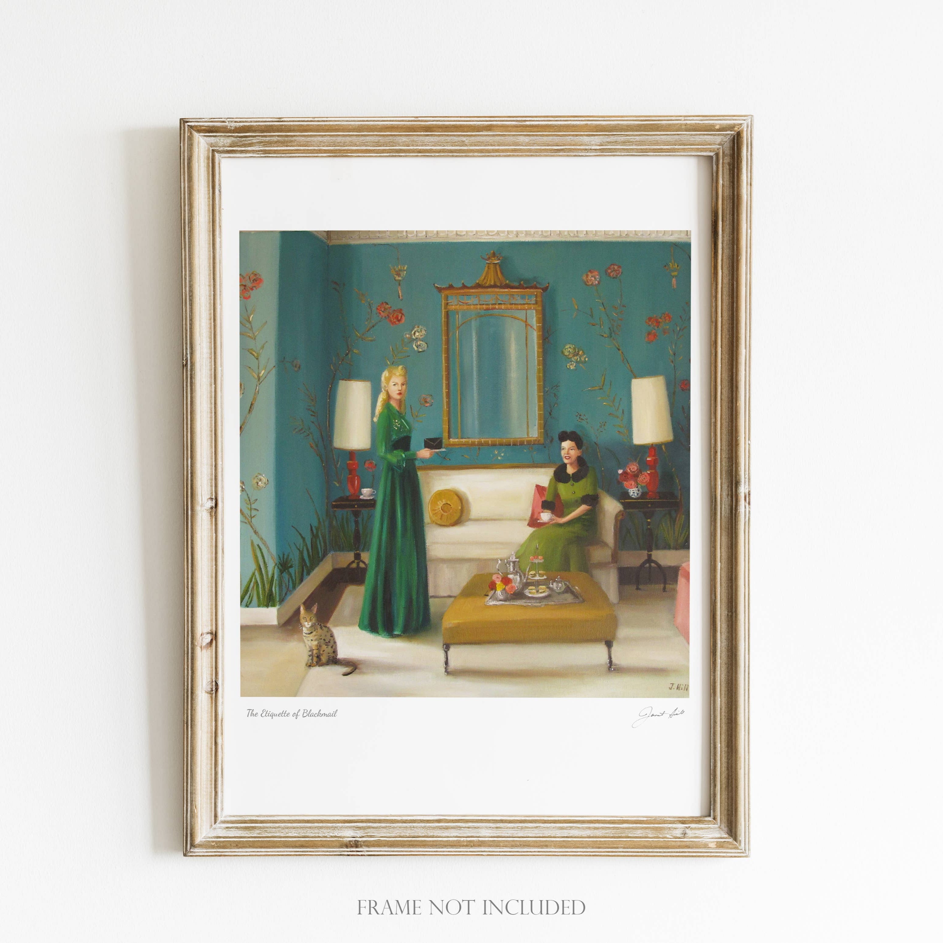 A framed art print featuring a Victorian-era sitting room with a woman in a green dress and a cat sitting on a bench.