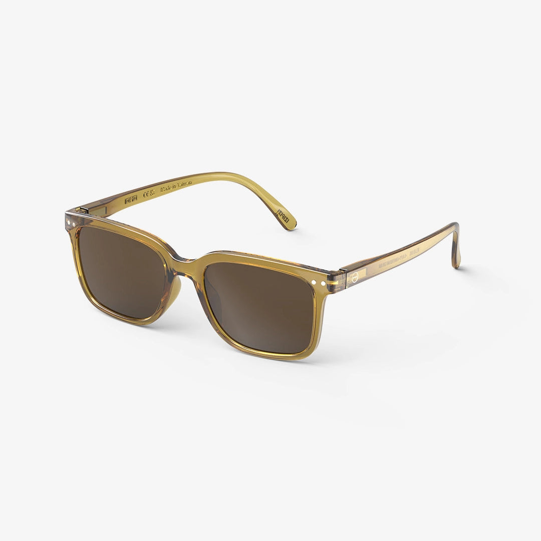 A pair of IZIPIZI #L Sunglasses with a golden green tint and flexible arms.