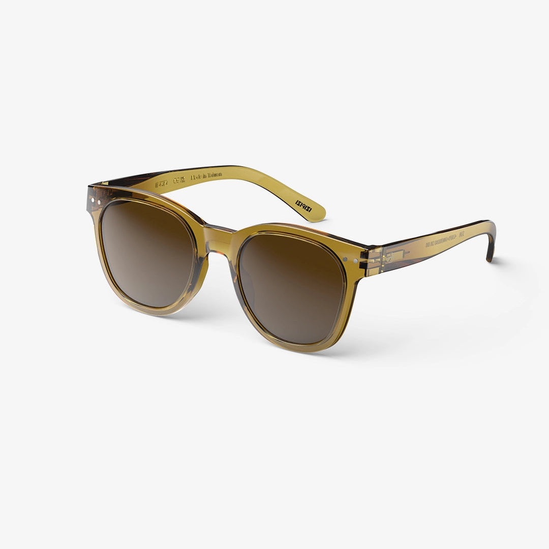 A pair of round-framed sunglasses with a golden green tint and matching temples.