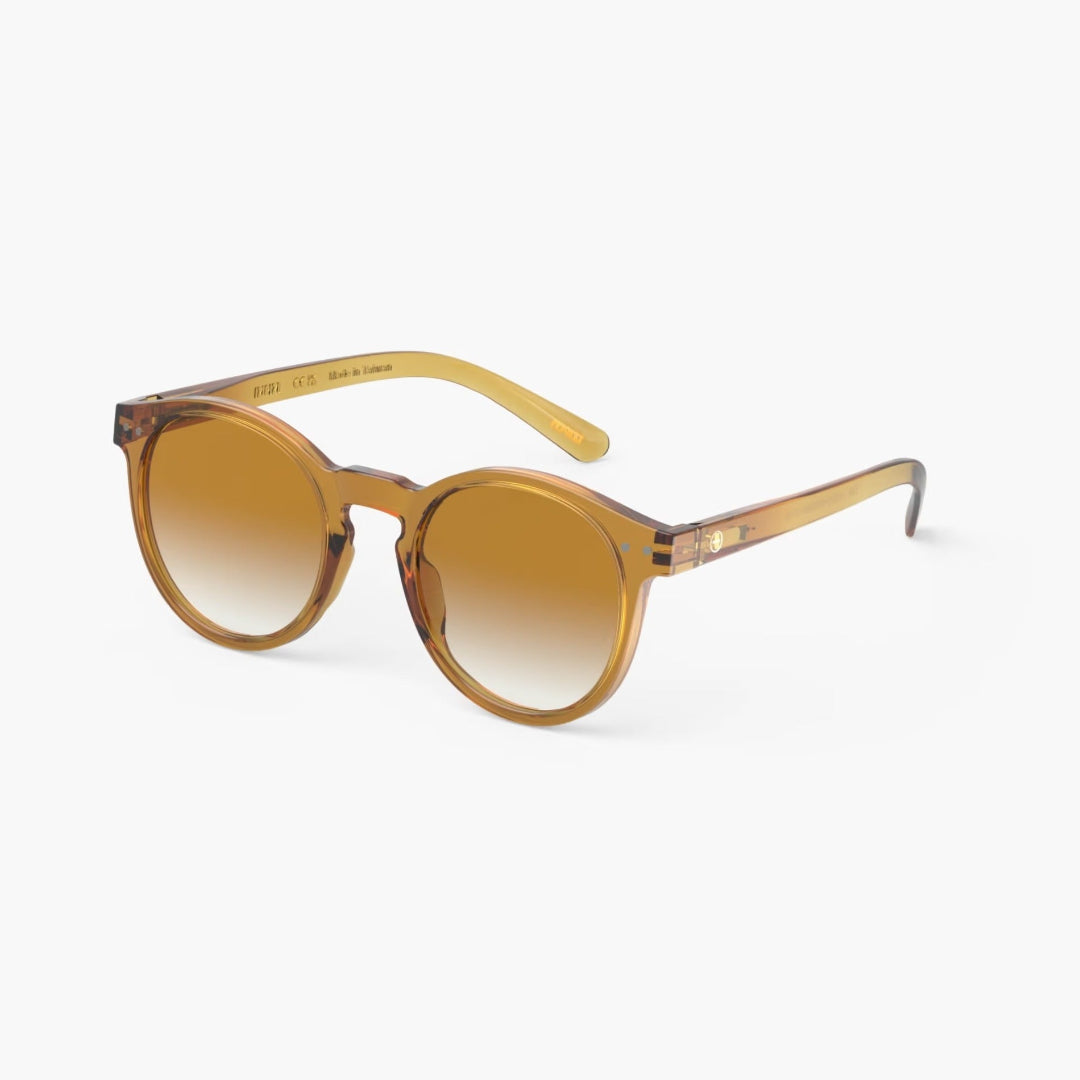 Golden yellow sunglasses with a gradient lens on a white background