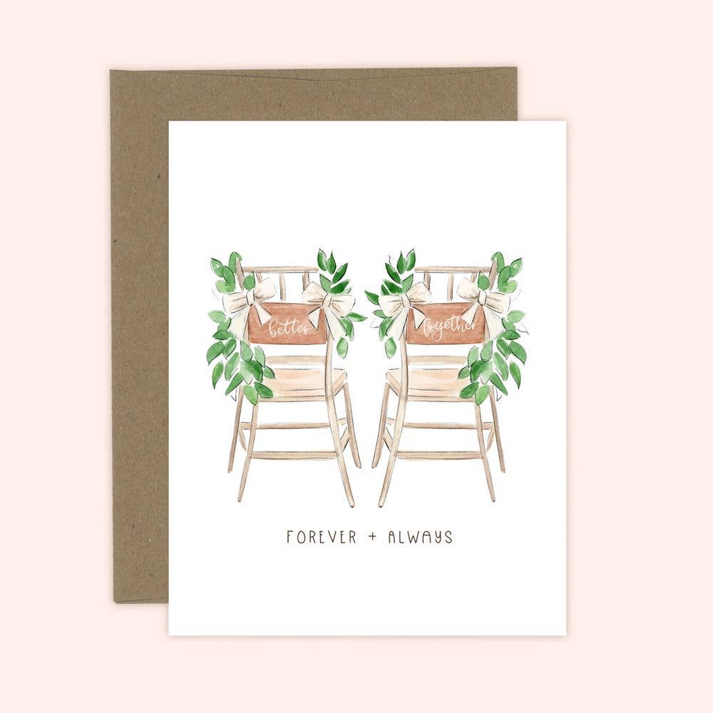 A greeting card with an illustration of two wooden chairs and greenery, with the text 'FOREVER & ALWAYS' below them.