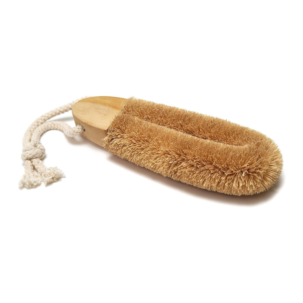 Coconut bristle foot brush on a white background