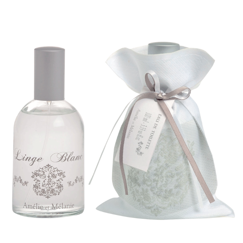 Bottle of 'Linge Blanc' and a white bag with a ribbon on a white background