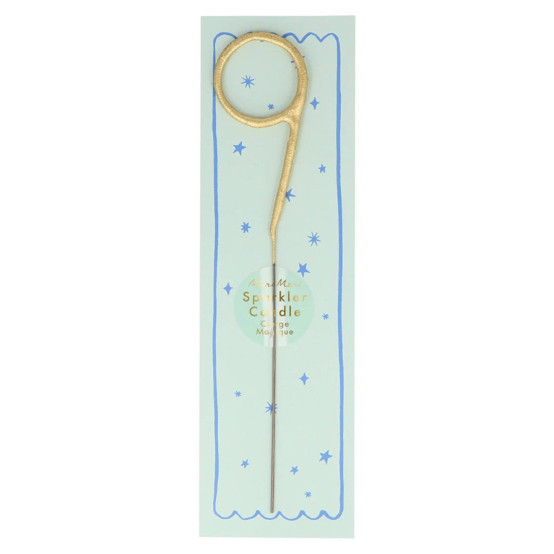 Gold sparkler candle on a light green card with blue stars