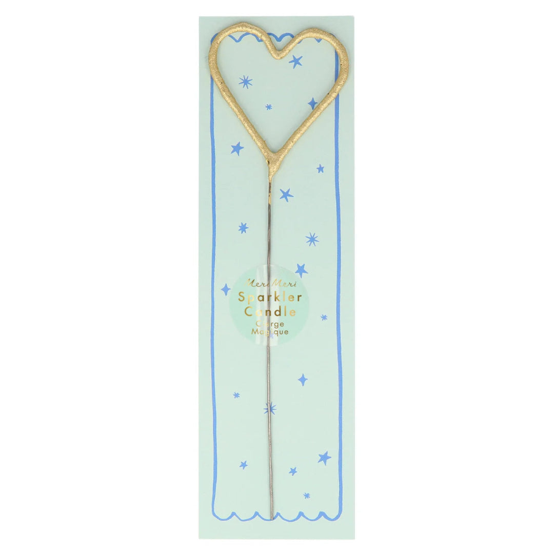Heart-shaped sparkler on a light green card with blue stars