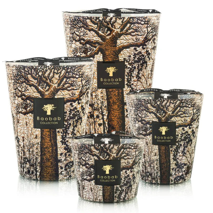 A collection of scented candles in glass holders, each adorned with a traditional African print design depicting a baobab tree.