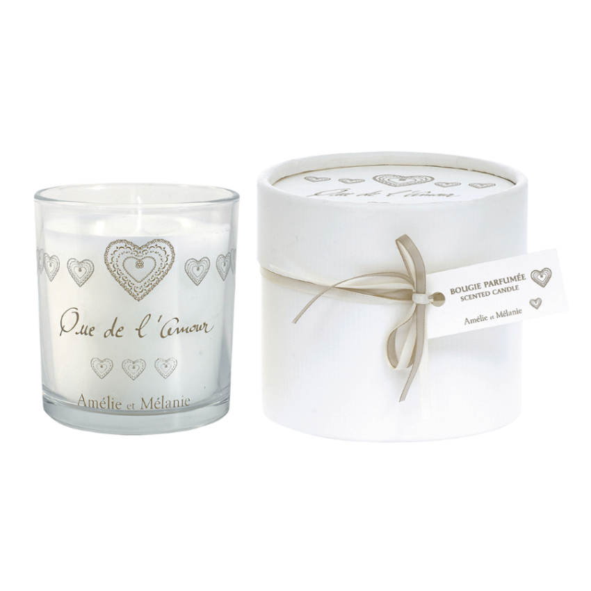 Candle with heart designs and packaging on a white background