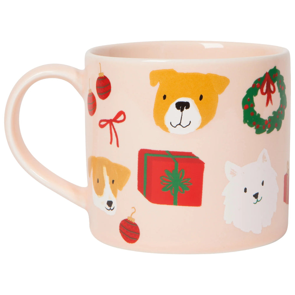 Pink mug with Christmas-themed designs including dogs, presents, and wreaths on a white background