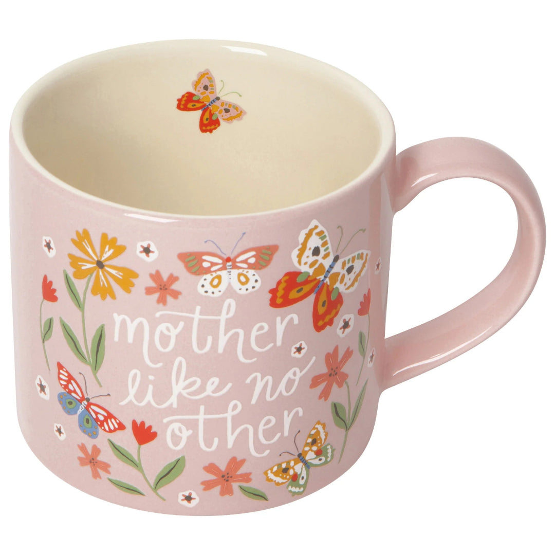 Pink mug with floral and butterfly design, featuring the text 'mother like no other'.