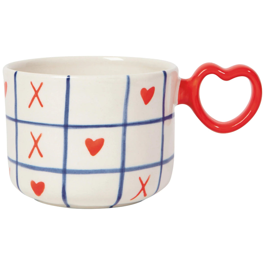 Mug with grid pattern, hearts, and 'X' symbols on a white background