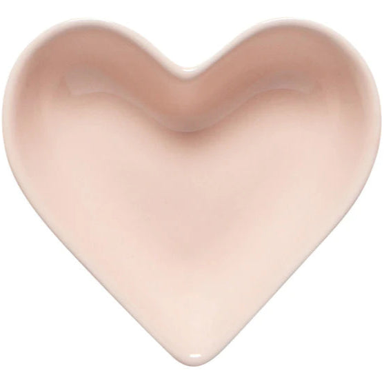Heart-shaped object in a soft pink color on a white background