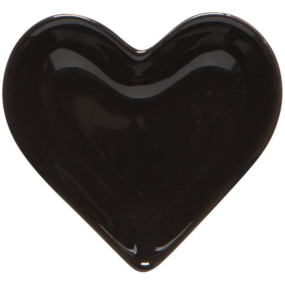 Black heart-shaped object on a white background