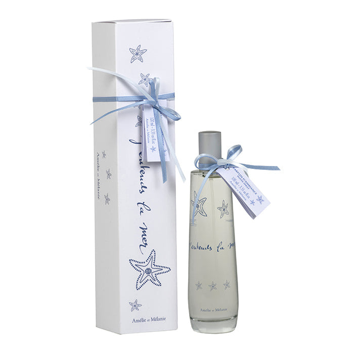 Perfume bottle with starfish design and matching packaging on a white background
