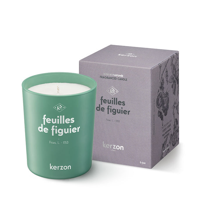 A green, square-shaped Kerzon fragranced candle with the label 'Feuilles de Figuier' on the packaging, indicating a fig leaf scent.