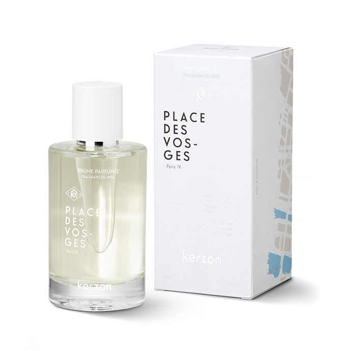 A clear bottle of Kerzon Place des Vosges fragranced mist with a white spray nozzle, accompanied by its white box with black text.