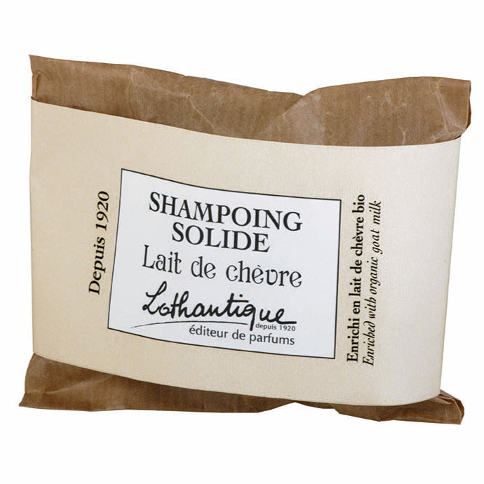 Lothantique solid shampoo bar in brown and beige packaging on a white background