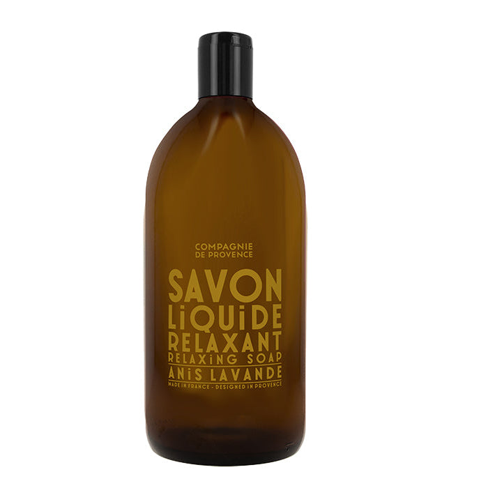 A brown plastic bottle of Compagnie de Provence liquid soap with a label that reads 'Savon Liquide Relaxant Anis Lavande'.