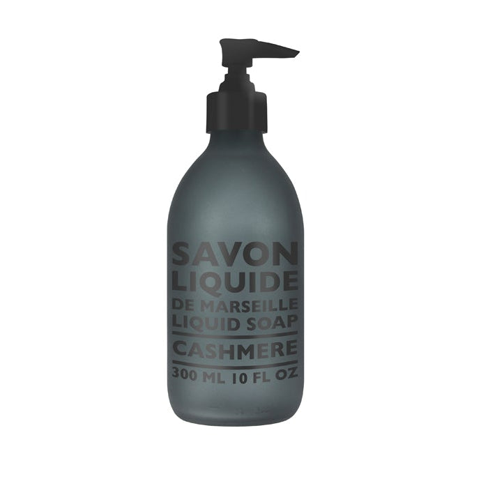 A frosted glass bottle with a black pump labeled 'SAVON LIQUIDE DE MARSEILLE CASHMERE 300ML'.