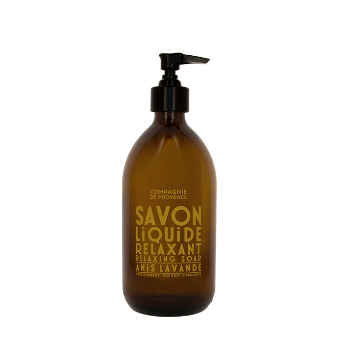 A brown glass bottle with a pump dispenser labeled 'Savon Liquide Relaxant' with white and yellow text, containing liquid soap.