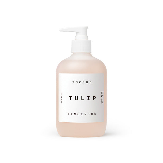 A pump bottle of Tangent GC Tulip Body Wash in a clear liquid, likely pink in color, with a white label that reads 'TULIP' and 'TANGENT GC'.