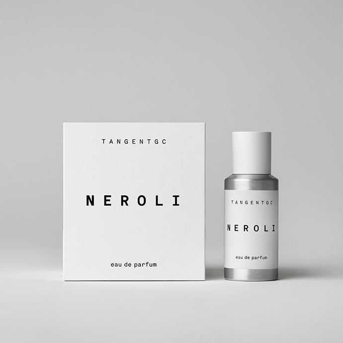 A white box and a silver bottle of Tangent GC Neroli Eau de Parfum, with the brand name and product name visible.