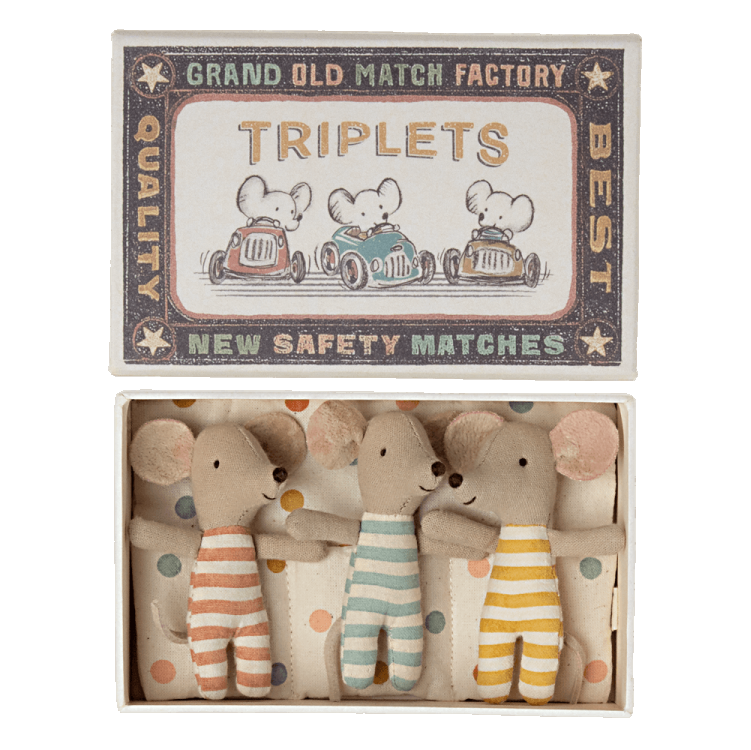 A set of three wooden dolls representing baby mice with striped patterns, presented in a open box labeled 'GRAND OLD MATCH FACTORY' and 'TRIPLETS'.