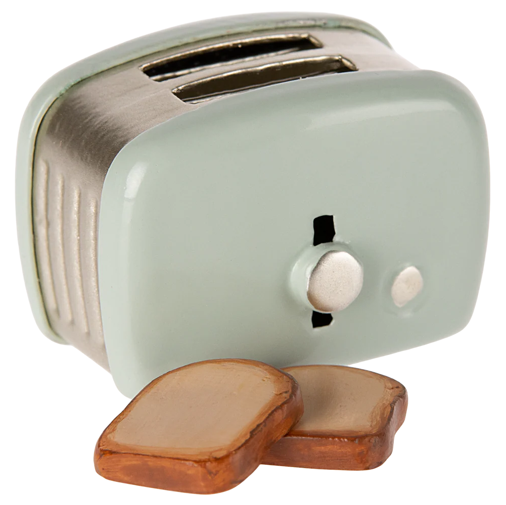 Small mint green toaster with two slices of bread on a white background