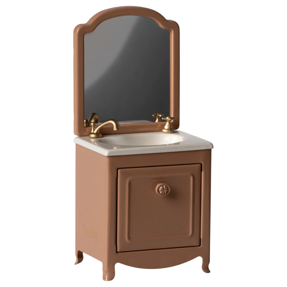 Brown bathroom vanity with mirror and sink on a white background