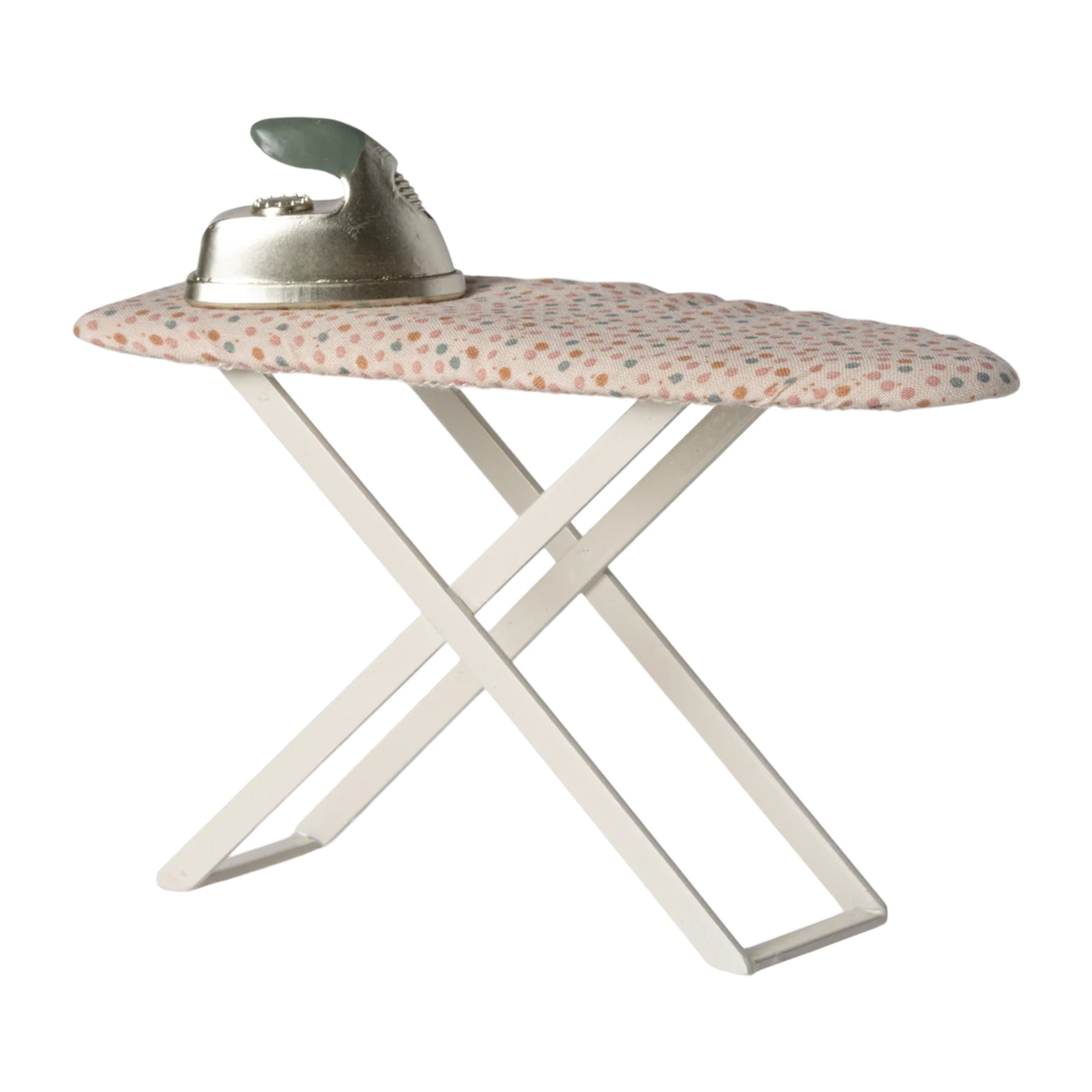 Folding ironing board with floral cover and iron on a white background