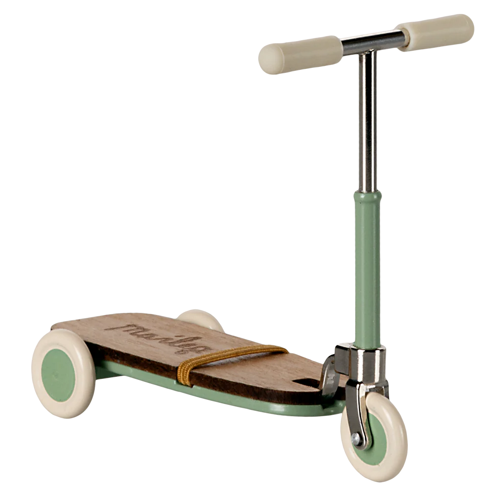 Children's scooter with wooden deck and green frame on a white background