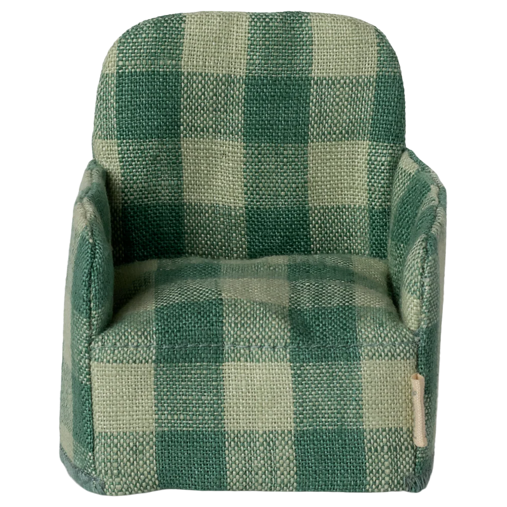 Green checkered armchair on a white background