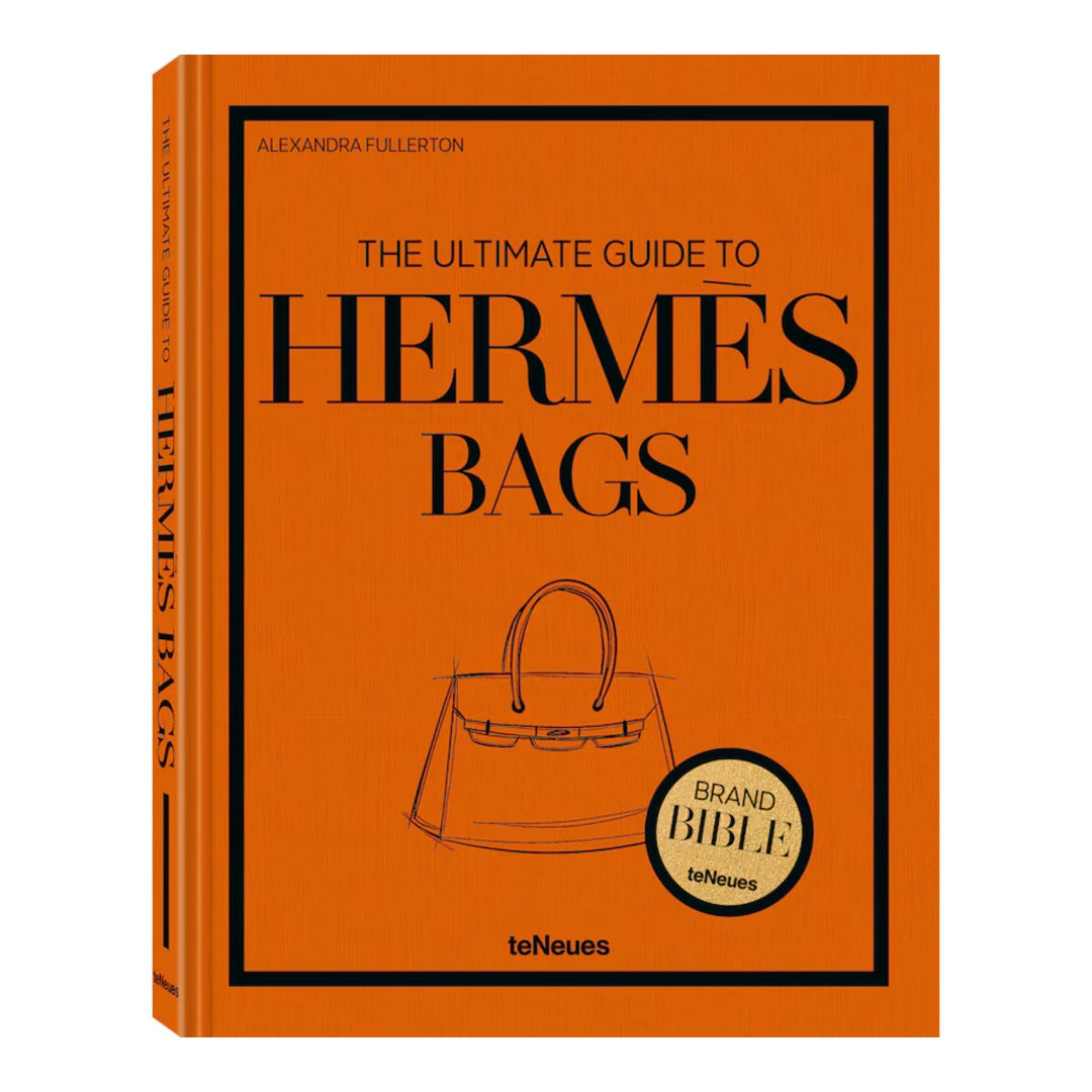 Book titled 'The Ultimate Guide to Hermes Bags' on an orange background