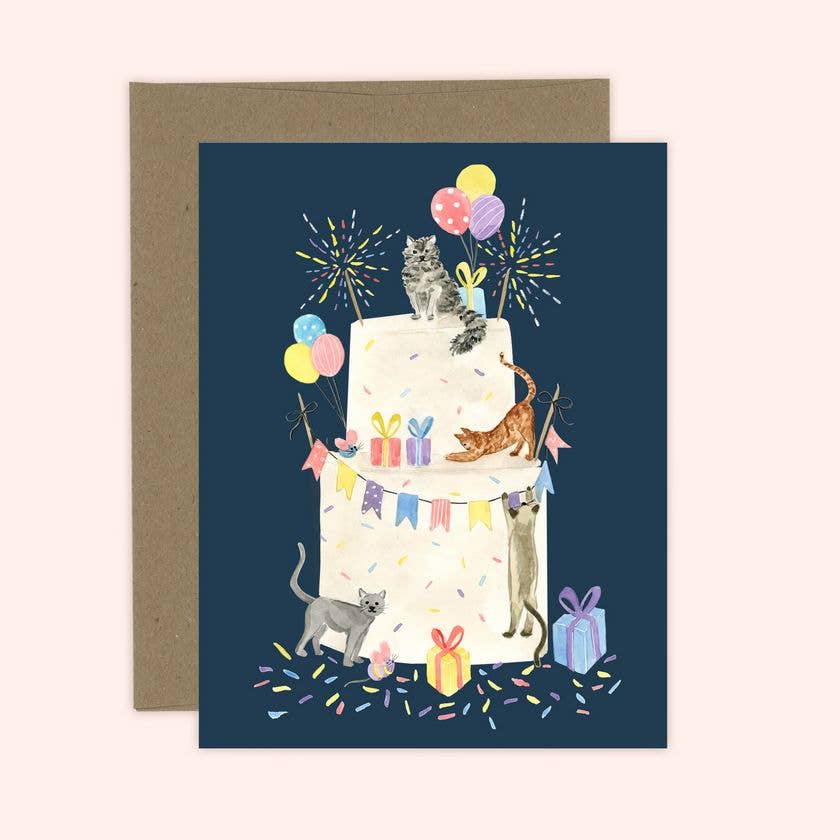 Greeting card with illustration of cats on a birthday cake with balloons and fireworks.