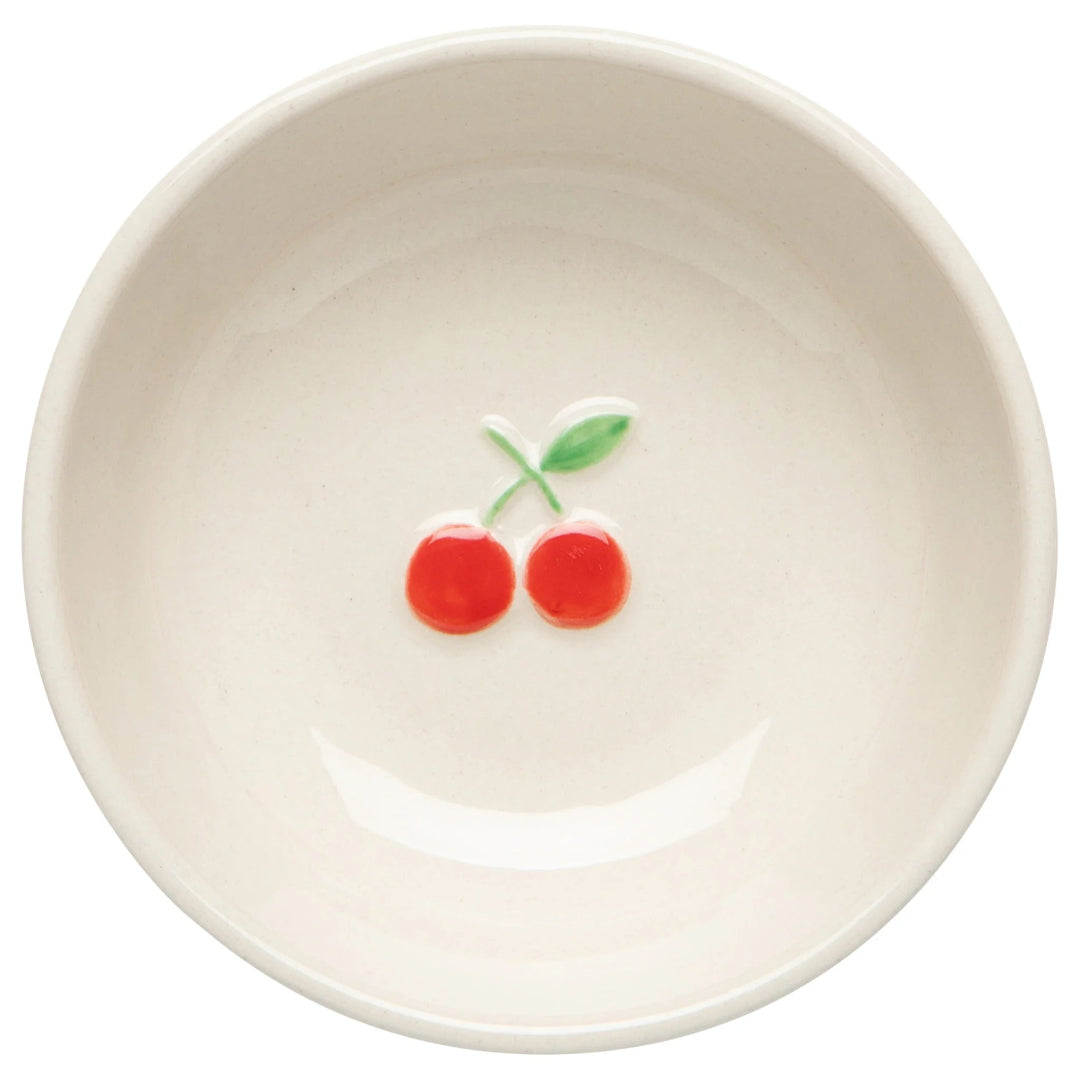 White ceramic bowl with red cherries on a white background
