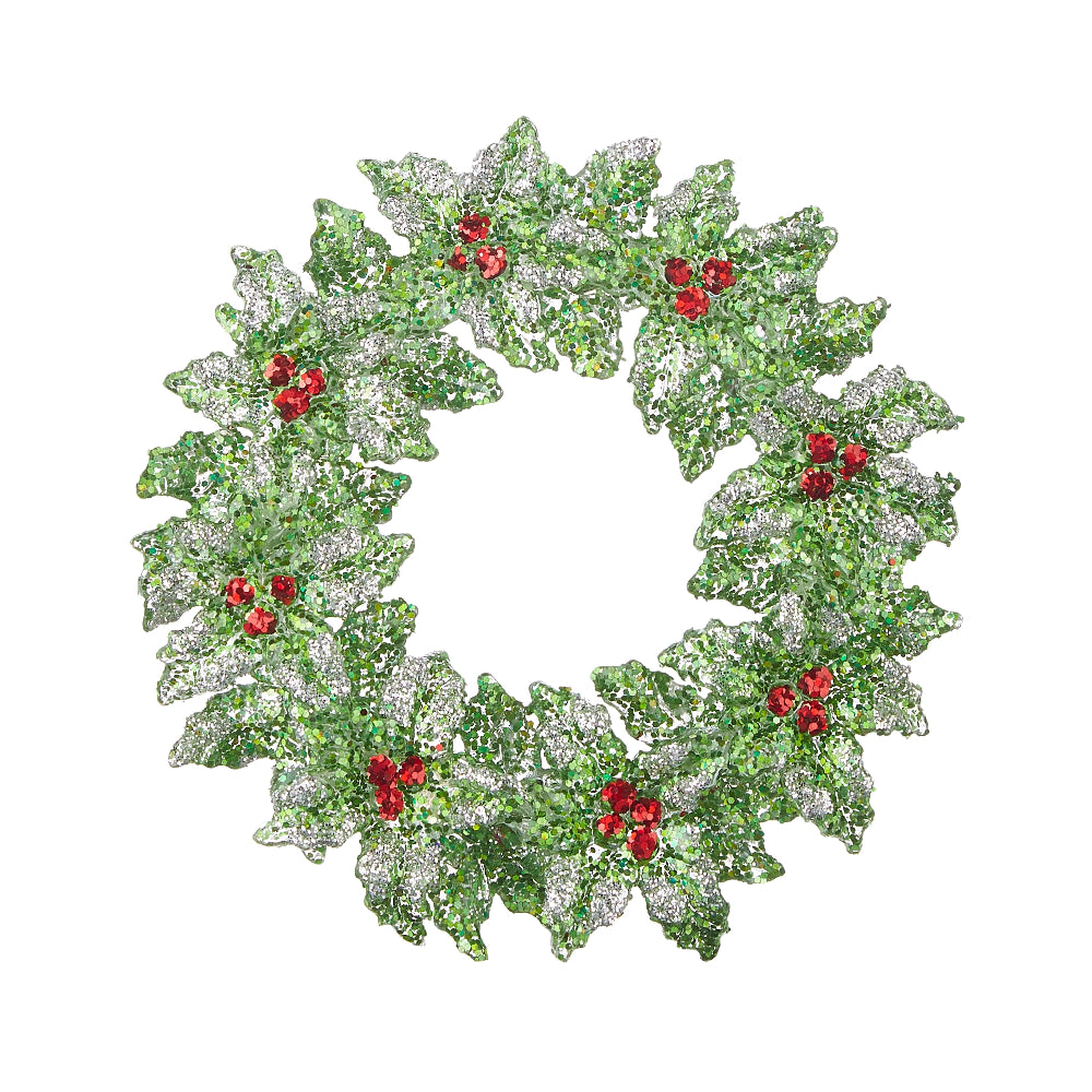 Decorative plastic wreath ornament with green leaves and red berries on a white background