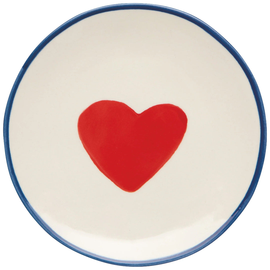 Ceramic plate with a red heart on a white background