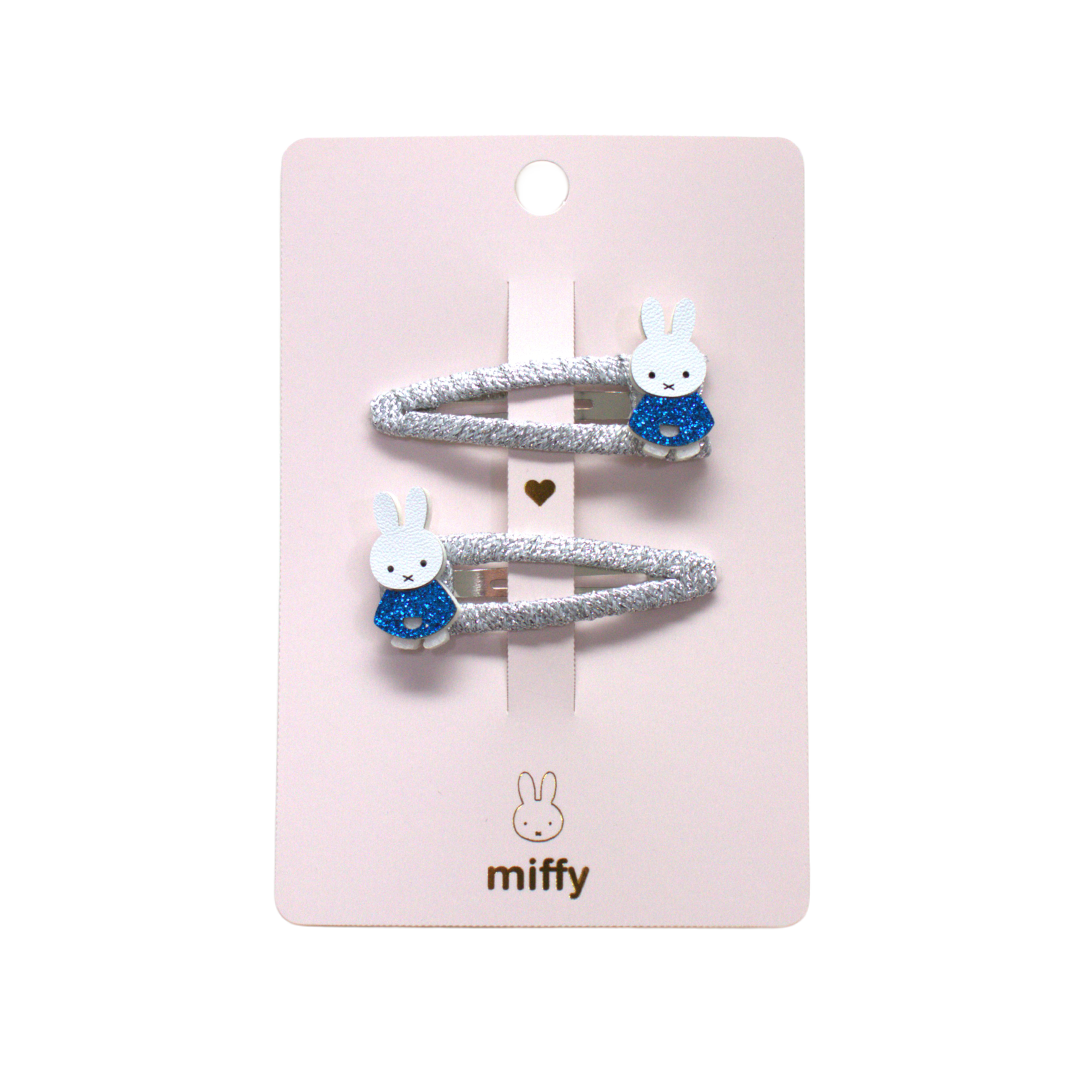Set of two hair ties with bunny designs on a pink card, featuring the brand 'miffy'.