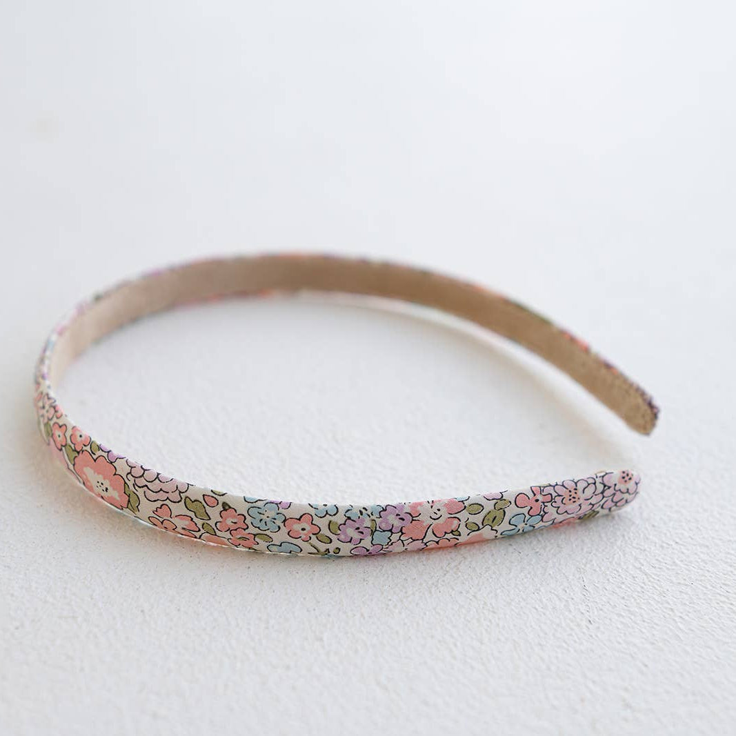 Floral-patterned headband on a white background