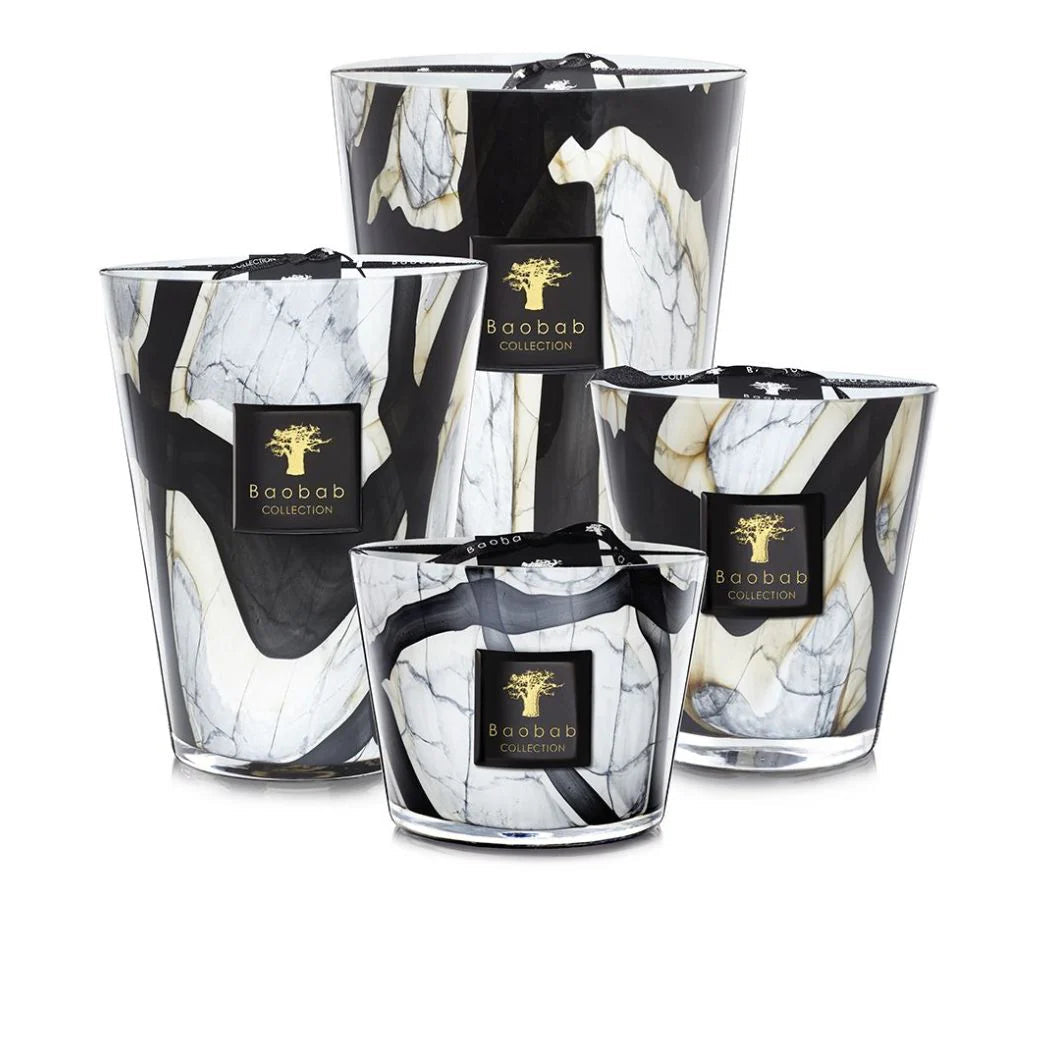 A collection of Baobab brand scented candles in marble effect glass holders, in various sizes.