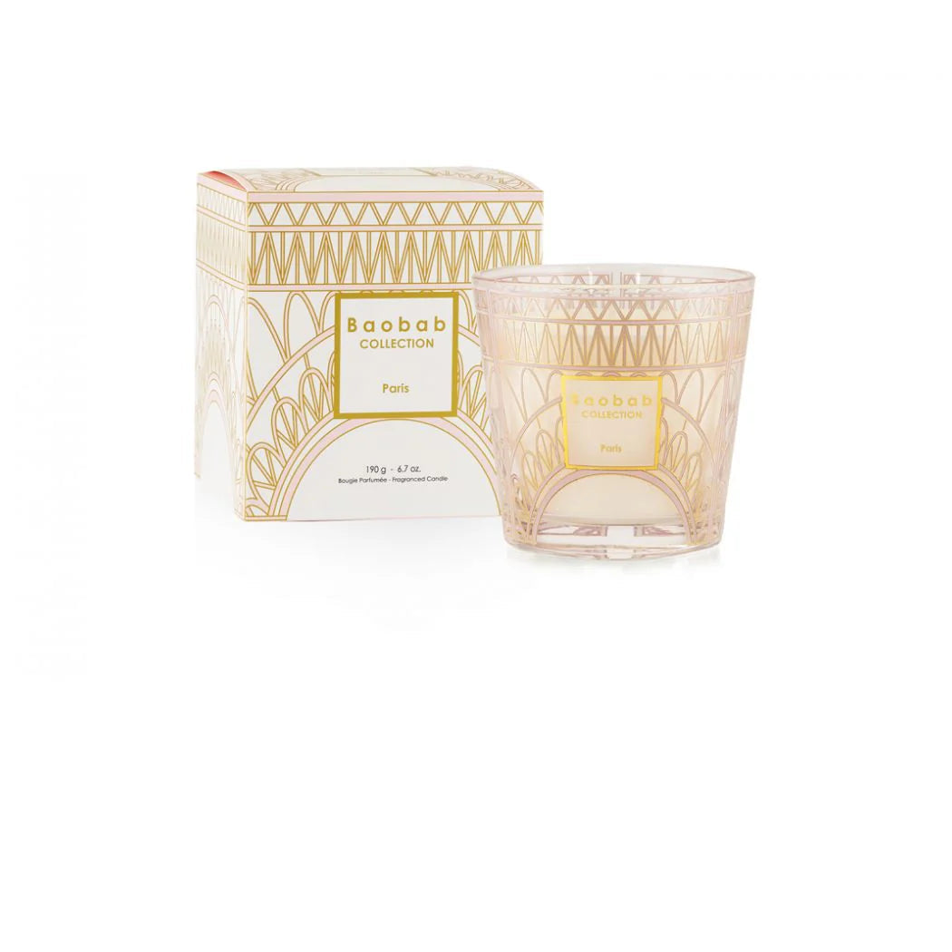 A Baobab Paris diffuser with a pink and gold design, depicting the Eiffel Tower, and its packaging.