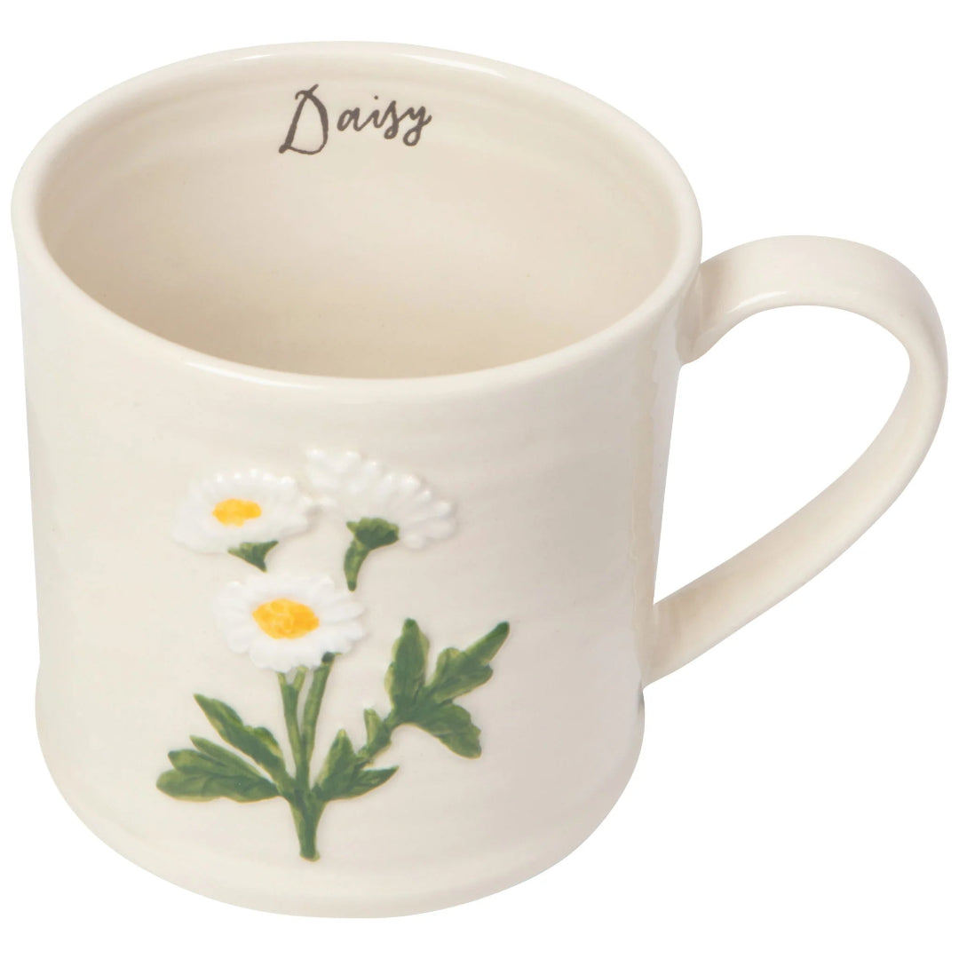 White mug with daisy design and 'Daisy' text on a white background