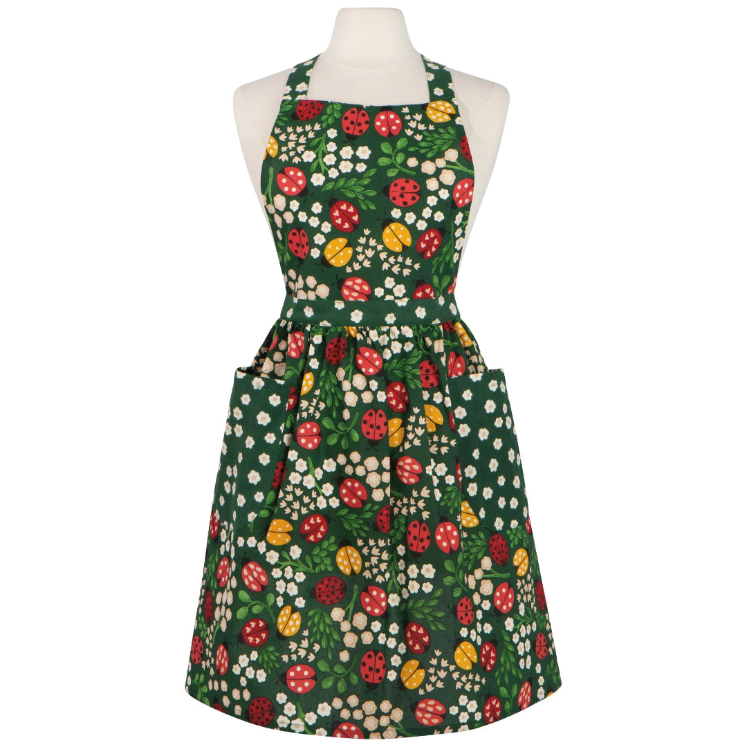 Floral apron with red ladybugs and green leaves on a white background