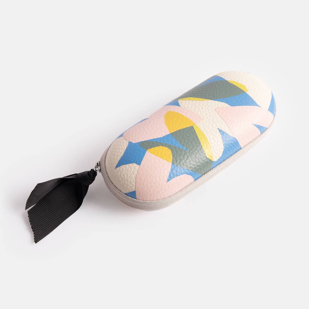Colorful abstract heart patterned glasses case with a black ribbon on a white background