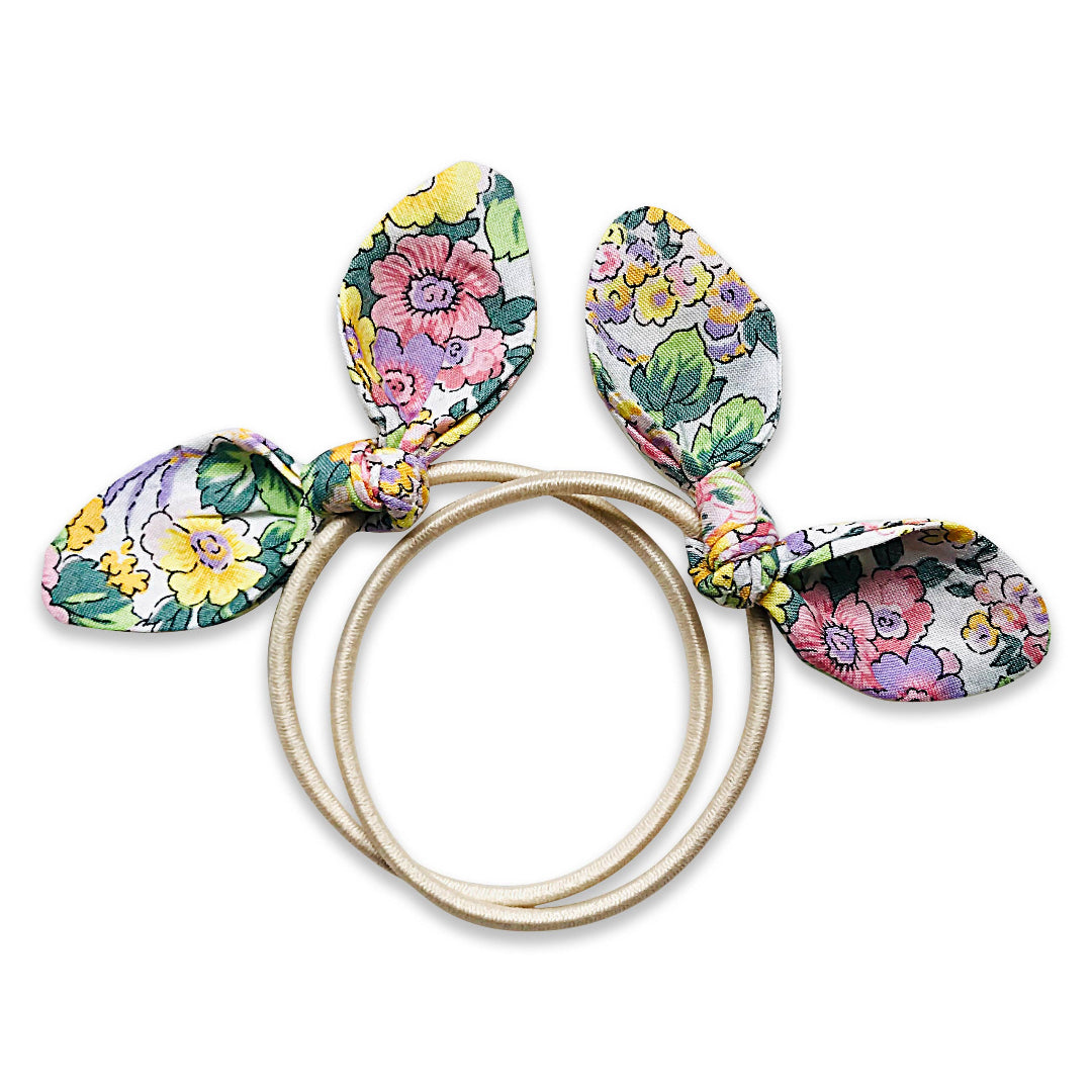 Floral hair ties with bunny ears on a white background