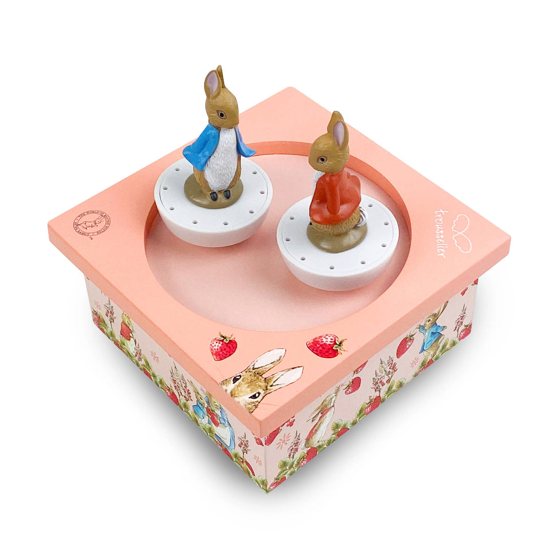 Decorative box with two small animal figurines on a white background