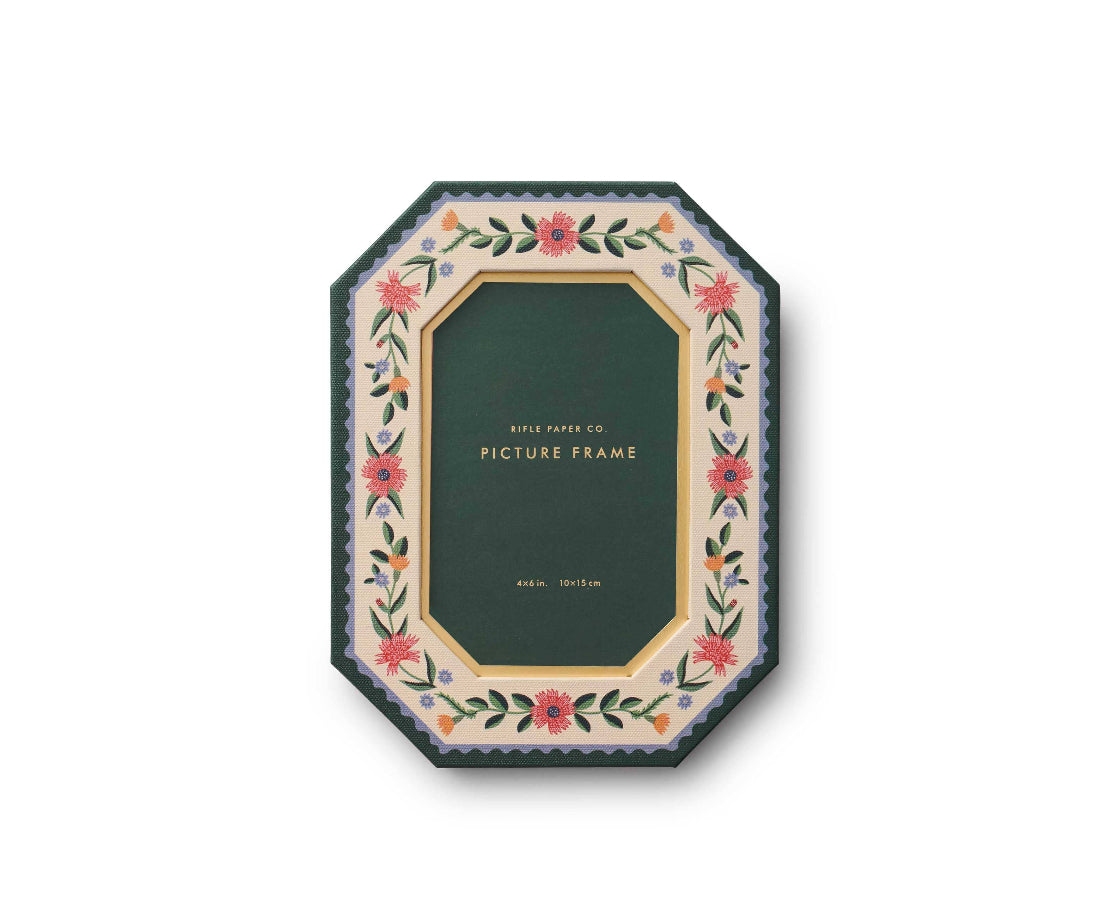 Decorative picture frame with floral design on a white background