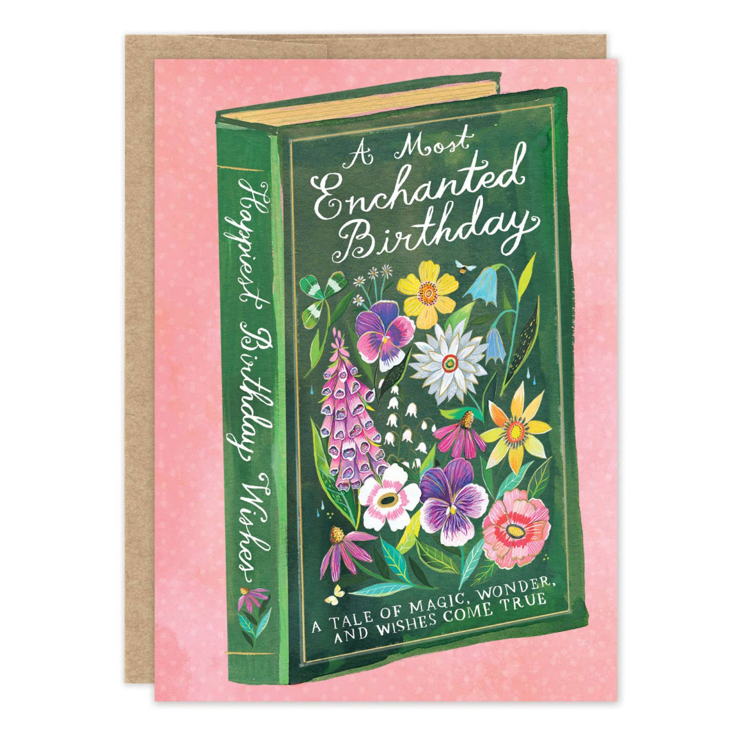 Greeting card with a book with a floral design and 'A Most Enchanted Birthday' text on a pink background