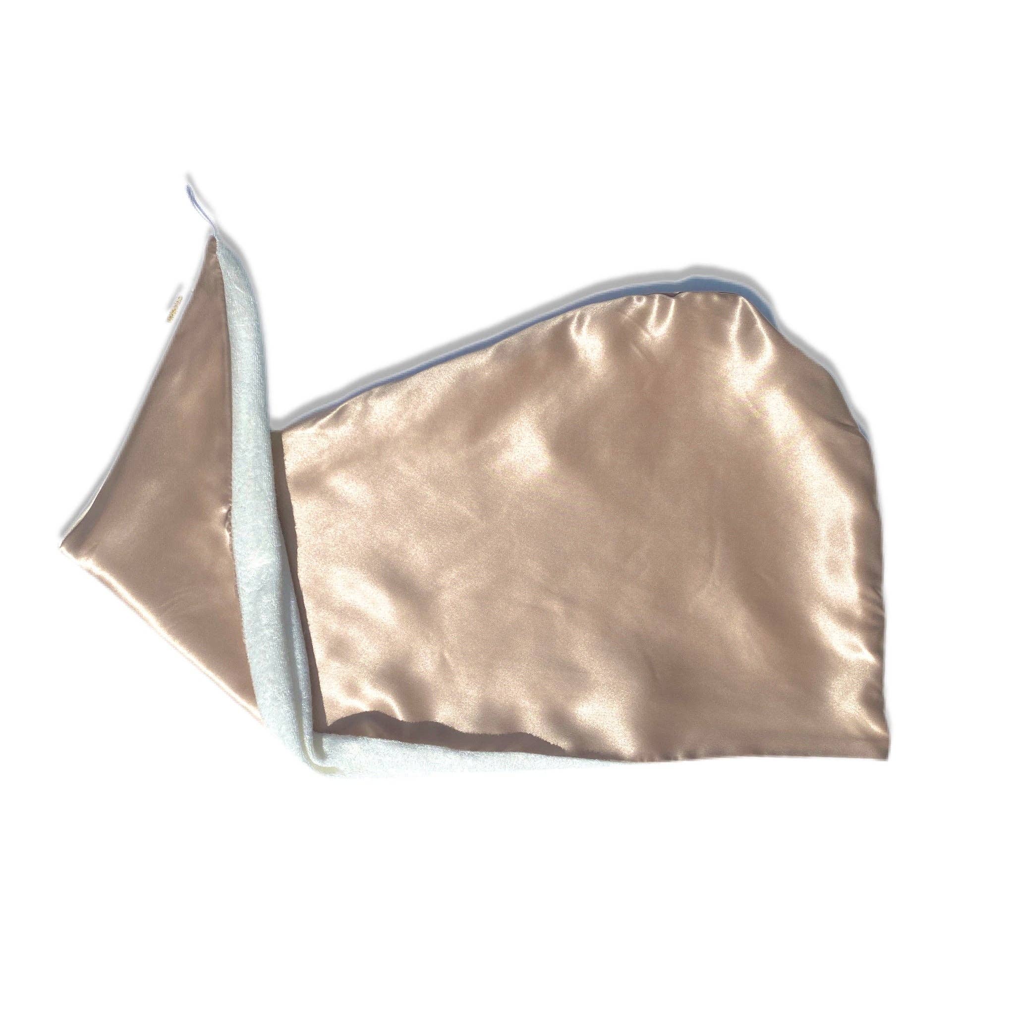A champagne-colored reversible silk hair wrap laid out flat, showing both the silk and bamboo towel sides.
